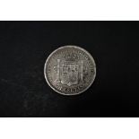A Spanish 5 pesetas 1871 silver coin.