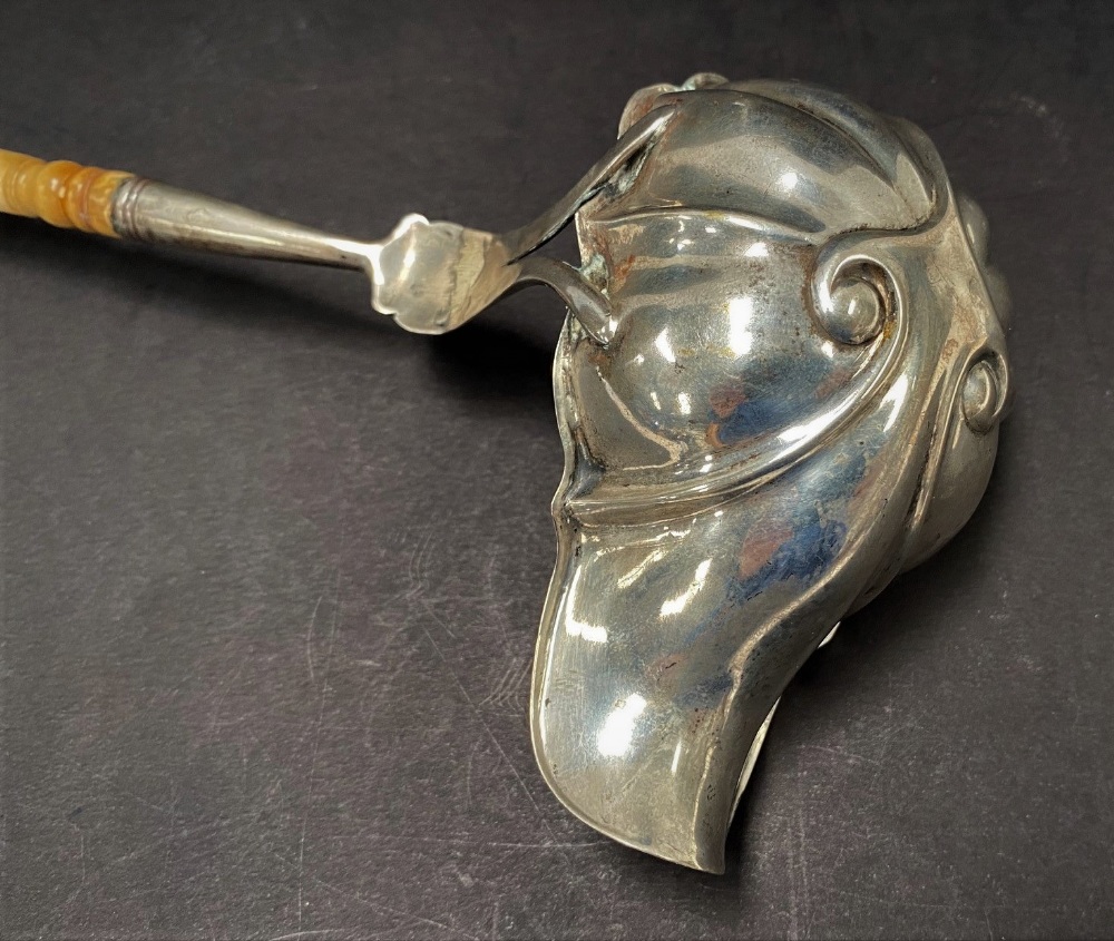 A Georgian silver ladle with ivory carved and fluted handle, with boat shaped embossed and lobed - Image 2 of 2