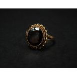 A 9ct. hallmarked gold garnet set ring, size O, weight 4g approx.