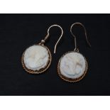 A pair of gold mounted cameo drop earrings, each oval cameo drop measuring 21mm, weight 5.1g