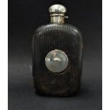 An unusual American sterling silver leather covered glass hip flask, with screw lid, the body with a