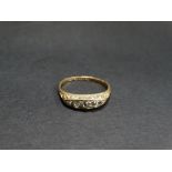 A Victorian 18ct. hallmarked gold diamond set five stone ring, the central diamond of 0.07ct. spread