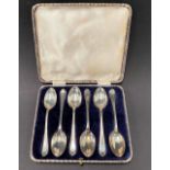 A set of six silver teaspoons by Walker & Hall, the handles decorated in relief with golf clubs