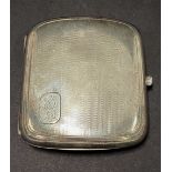 A George VI silver engine turned cigarette case with engraved monogram, maker D & F, Birmingham