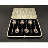 A George V silver set of six boxed 'Old English' pattern demi tasse spoons, maker E.M.D.,