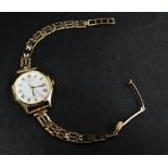 A ladies Seiko quartz wristwatch in gold plated case and with 9ct. hallmarked gold bracelet,