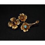 A modern 9ct. hallmarked gold flower brooch set with an aquamarine, citrine and garnet, length 54mm,