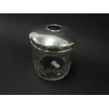 A silver lidded cut glass toilet jar, weight of silver 0.70oz approx.