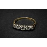 An 18ct. gold diamond set five stone ring, the largest central diamond of 0.25ct. spread approx.