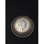 An 1891 Austro Hungarian 10 franc silver coin filigree circular brooch, diameter 43mm, weight 19.