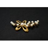 A gold nugget applied pearl set yellow metal brooch, length 47mm, weight 7.2g approx.