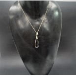 A gold mounted amethyst teardrop shape pendant necklace, the amethyst measures 21 x 5mm approx.
