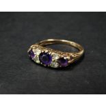 A modern 9ct. hallmarked gold Victorian style amethyst and clear stone set ring, size 17.5mm