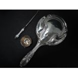 A George V silver dressing table mirror, Birmingham 1917, together with a silver tea strainer with