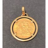 A George V 1914 half sovereign 9ct. gold mounted pendant necklace, weight 6g approx.