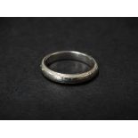 An 18ct white gold foliate engraved band ring, weight 5.4g approx., size 17mm diameter approx.
