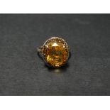 A 9ct. rose gold citrine set cocktail ring, the oval cut citrine measures 12 x 10mm approx., size