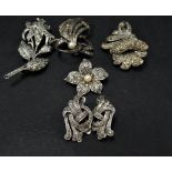 Four 925 silver marcasite set brooches, together with a pair of 925 silver marcasite set clip