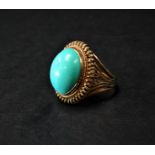A high purity gold turquoise cabochon set cocktail ring, the turquoise measuring 17 x 12mm