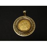 An Edward VII 1908 sovereign 9ct. gold mounted pendant, the mount with rope twist borders, weight