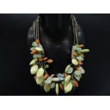 An eccentric heavy semi precious stone bead necklace with silver clasps, length 54cm.