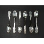 A Victorian silver set of six teaspoons, the handle with foliate strapwork, bright cut decoration