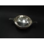 A George V silver twin handled bowl, maker C & N, Birmingham 1927, diameter 11.5cm, weight 4.70oz