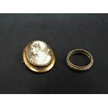 A 9ct. bi colour clear stone set band ring, size N/O, together with a yellow metal shell cameo