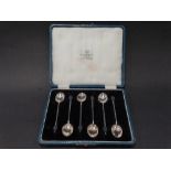 A George V silver cased set of six coffee bean demi tasse spoons, Birmingham 1923, weight 1.50oz