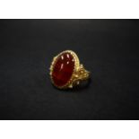 A continental Renaissance style high purity gold carnelian cabochon set ring, the shank with