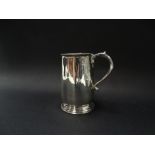 An Edwardian silver pedestal mug with loop handle, engraved monogram, maker JW, Birmingham 1905,
