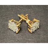 A pair of 10k gold diamond cluster earrings, the central diamonds of 0.04ct. spread approx.,