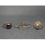 A 9ct. gold Russian three band ring, together with a 9ct. white stone set ring and a 9ct. pink stone