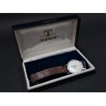 A Tissot gentlemans manual wind wristwatch within steel case and original box, the 28mm white dial