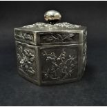 A Chinese white metal hexagonal box foliate embossed and chased, the base with maker's mark LSC,