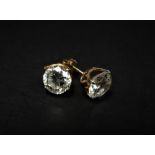 A pair of 18ct. gold CZ set stud earrings, weight overall 3.4g approx.