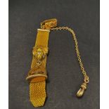 A gold plated pocket watch hanger with mesh strap applied with a lion with red paste eyes and