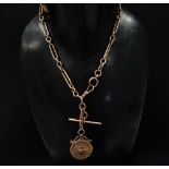 A 9ct. rose gold fancy link Albert watch chain with 9ct. shield fob with inscription, weight 28.3g