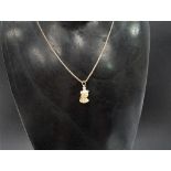 A gold pendant in the form of Cleopatra on an 18ct. gold necklace, length of necklace 42cm, weight