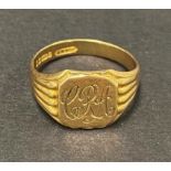 A 9ct. hallmarked gold gentleman's signet ring with engraved monogram, weight 5.3g approx.