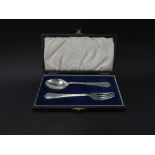 A George VI silver christening fork and spoon within fitted box, maker C.E., Sheffield 1947,