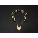 A 9ct. gold heavy curb link bracelet with padlock clasp, weight 45.9g approx.