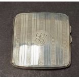 A George V silver engine turned cigarette case, width 8.5cm, Birmingham 1923, weight 3.50oz approx.