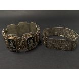 A 925 silver Siam niello seven panel bracelet, each panel decorated with immortals, stamped SILVER