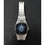 A Seiko ladies stainless steel bracelet manual wind wristwatch, the square blue metallic 13mm dial