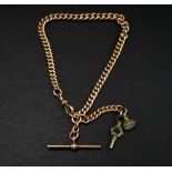 A 9ct. hallmarked gold graduated curb link watch chain Albert with suspension chain holding a