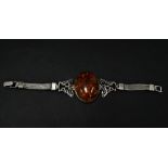 A modern silver bracelet set with a large amber cabochon, weight 34.8g approx.