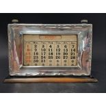 A George VI silver mounted mahogany perpetual desk calendar, maker WJM & Co, Birmingham 1948,