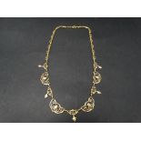 An attractive 9ct. gold fancy link necklace with milligrain openwork links and five leaf shaped