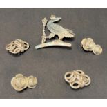A modern silver hallmarked brooch cast and pierced as an eagle wearing a crown and holding a